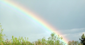 A rainbow landing at the lap of the Himalayas rainbow landing